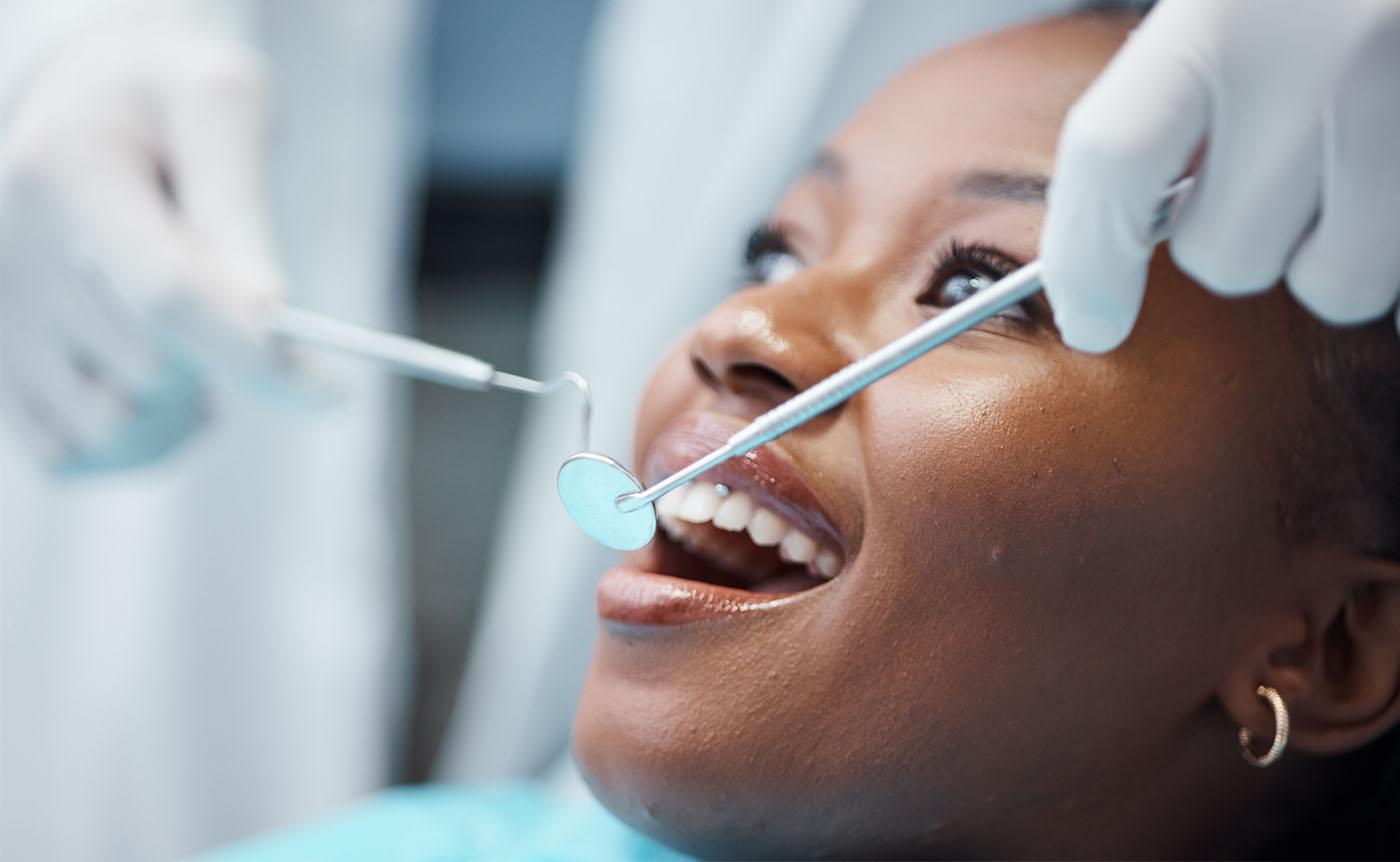 Dentist examining a patient's teeth